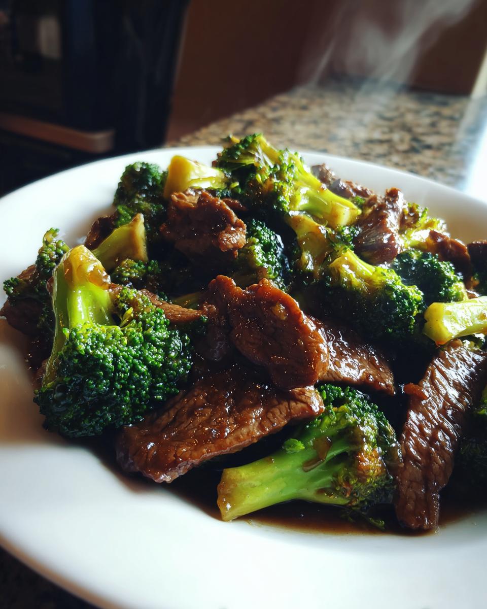 Close-up of a plate of Beef and Broccoli Stir-Fry, featuring tender beef and vibrant green broccoli in a savory sauce.